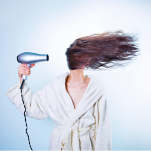 Woman Blow-Drying Her Hair