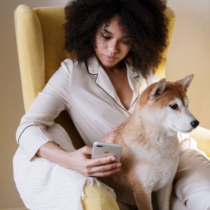 Woman wearing pajamas with her dog